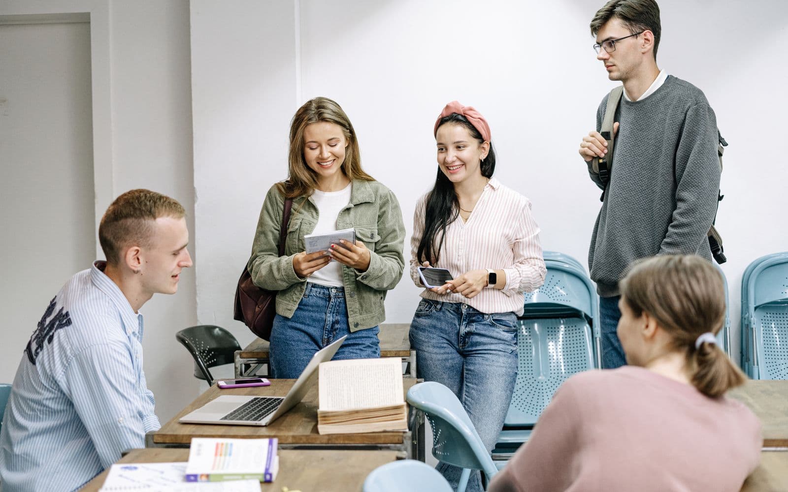 A diverse group of adult learners studying together